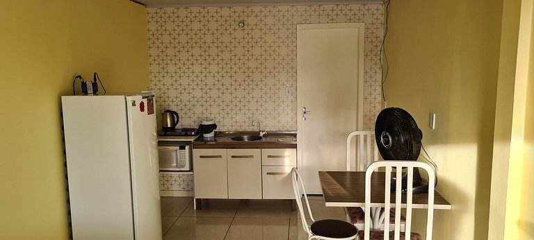 Loft no Centro com ar cond., Netflix e cozinha