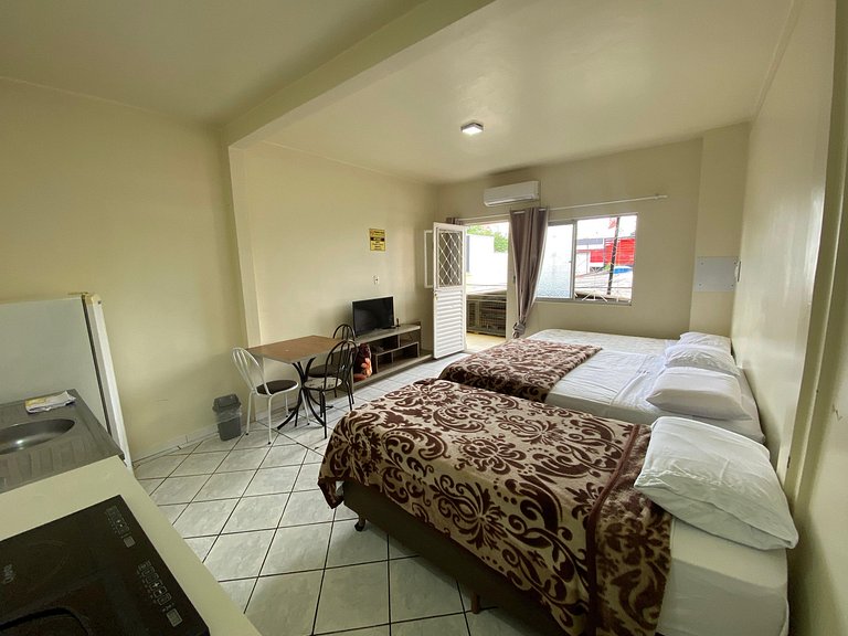 Loft no Centro com Ar. cond, Netflix e cozinha